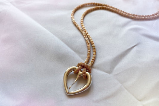 Love buckle pendant with mesh coated chain