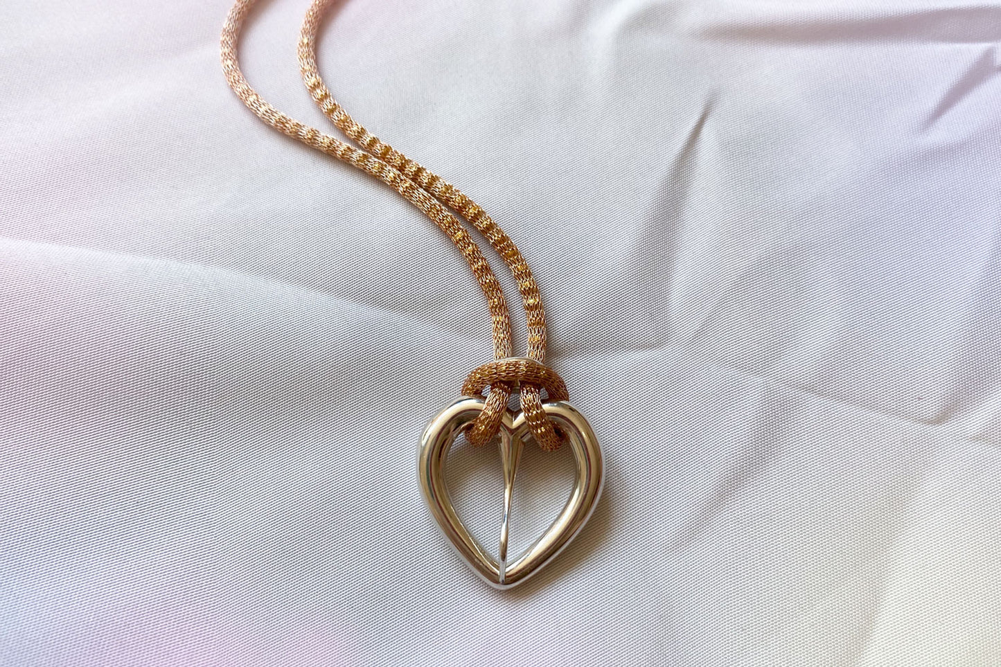 Love buckle pendant with mesh coated chain