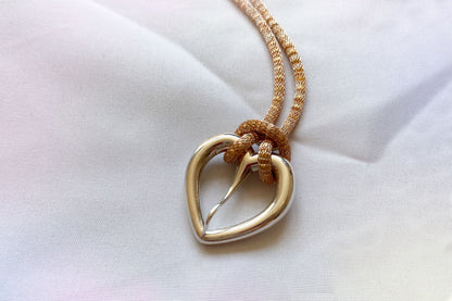 Love buckle pendant with mesh coated chain